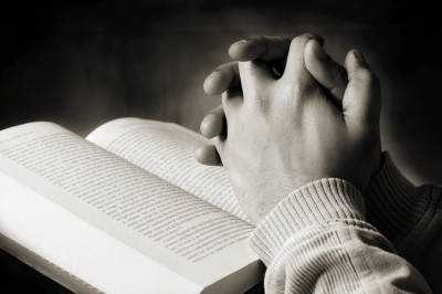 bible-with-praying-hands.jpg
